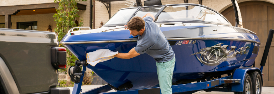 Man Cleaning His Boat For Storage