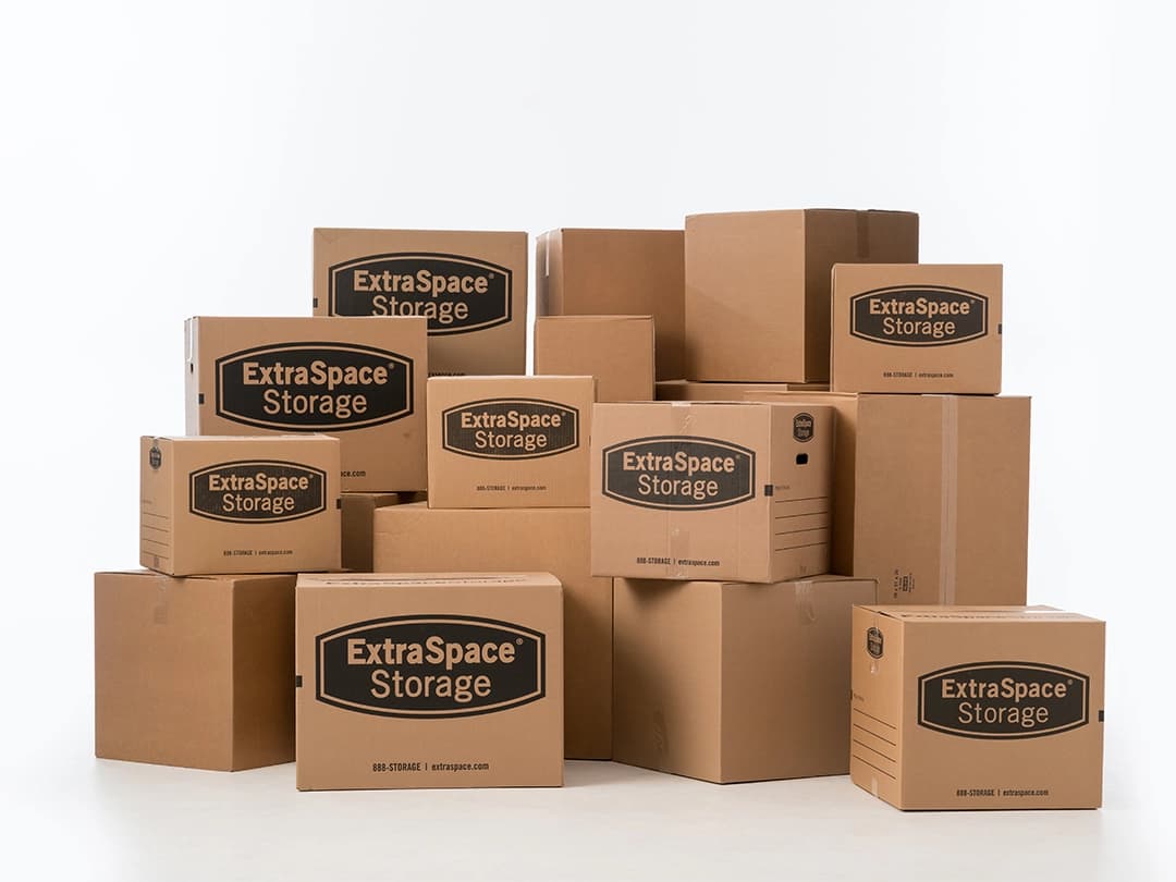 Moving boxes from Extra Space Storage stacked together.