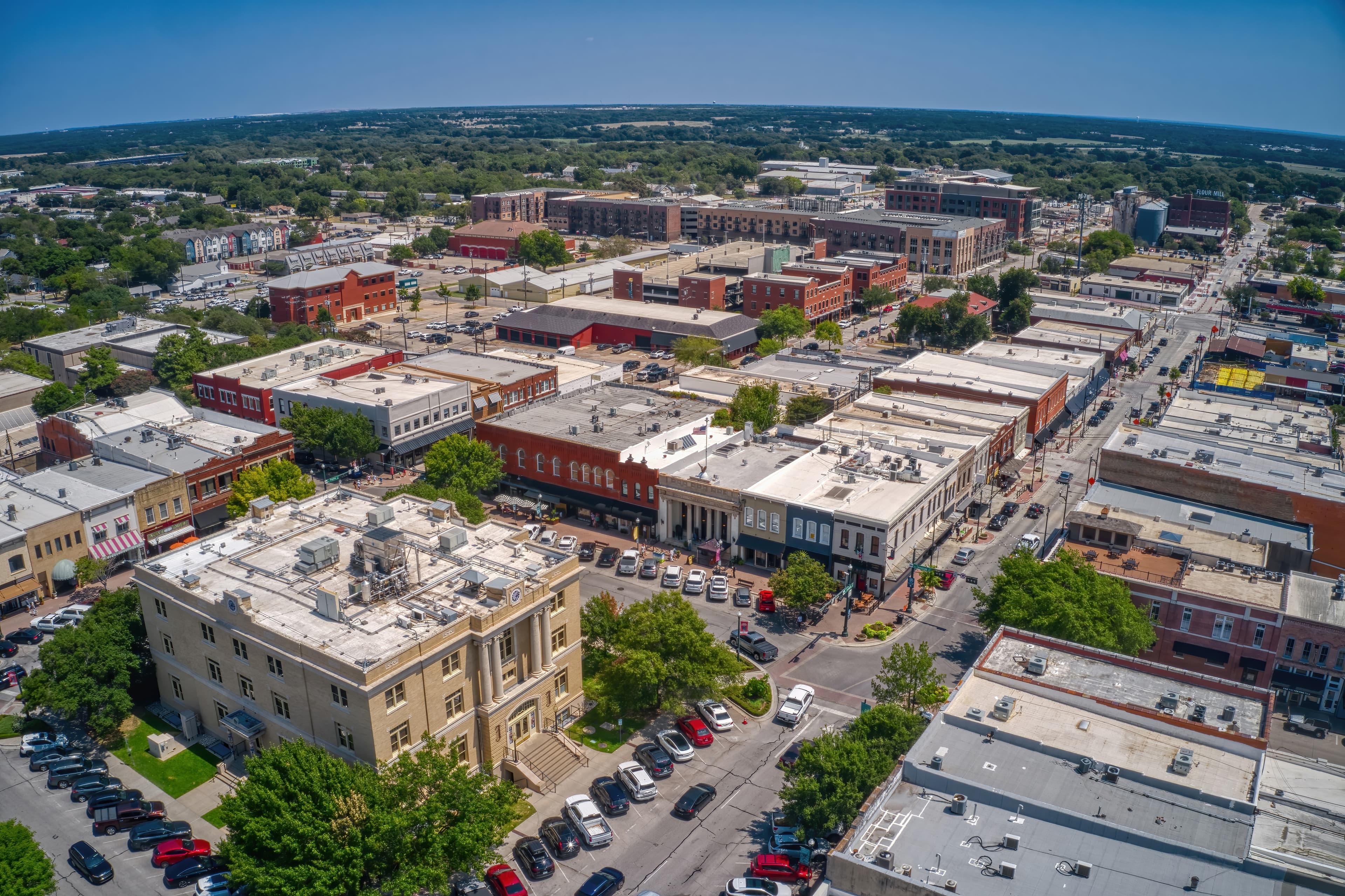 Aerial view of Mckinney, TX in daytime.