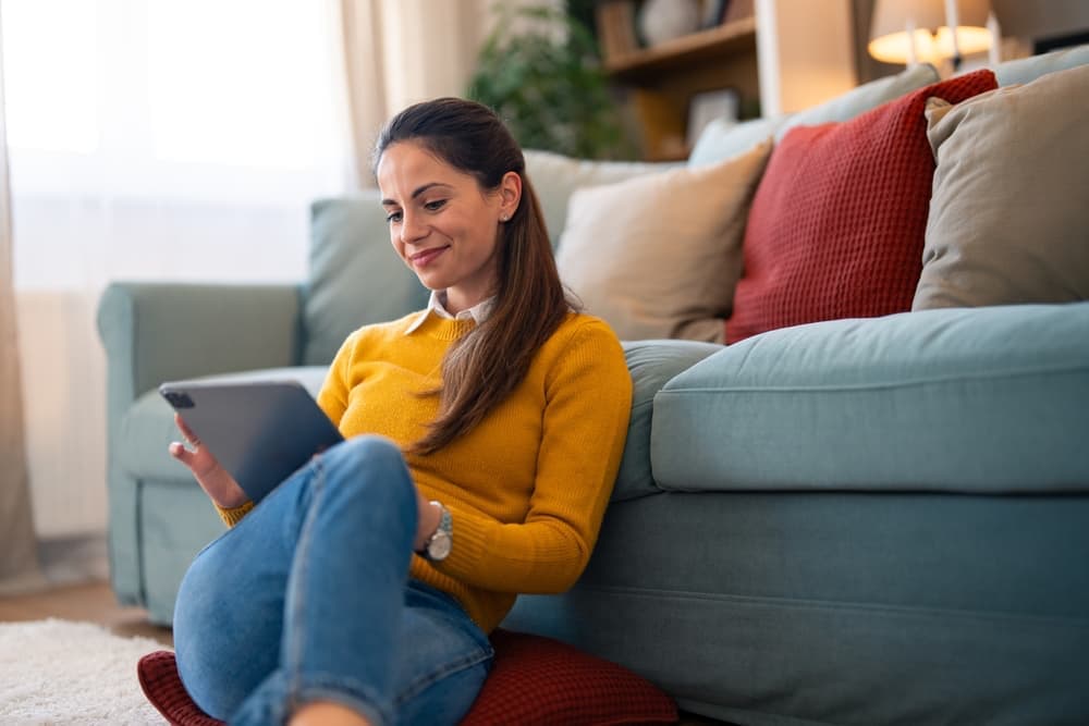 Woman using a tablet to help plan her move