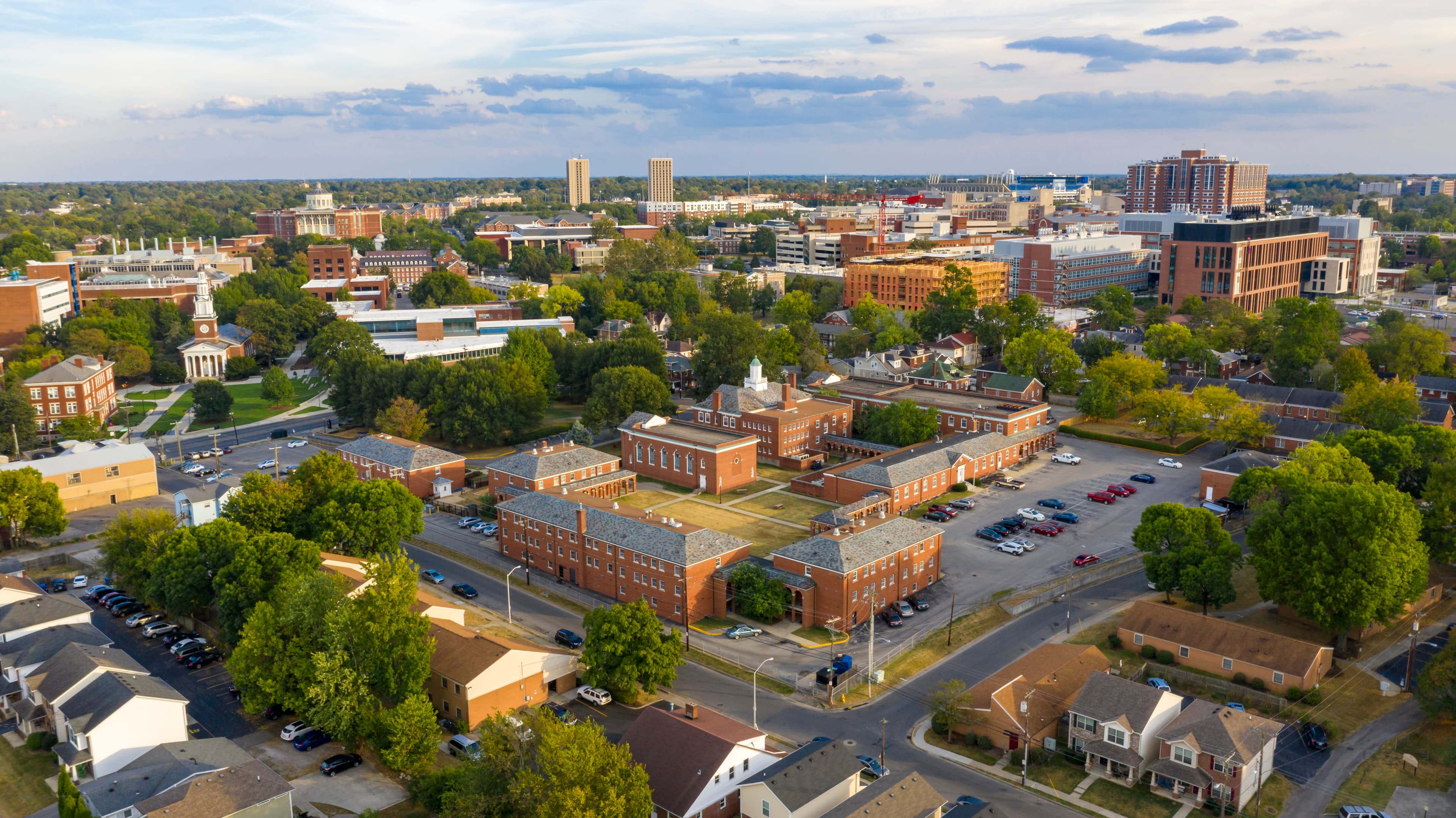 Overhead view of Lexington, KY featuring brick city government buildings and tree-lined streets on a sunny day.