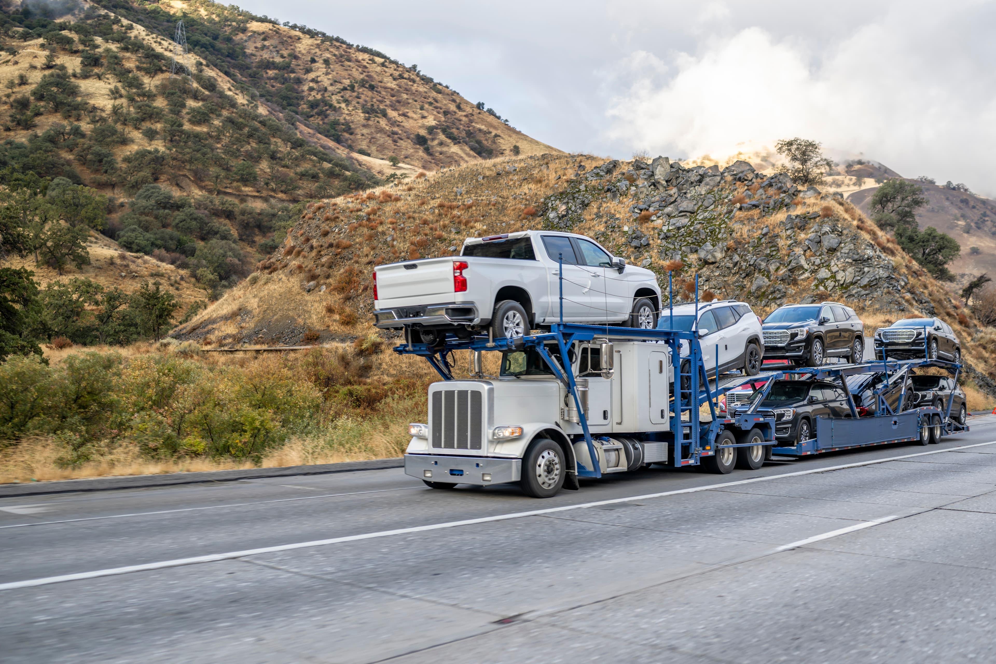 Truck with cars on top for transport