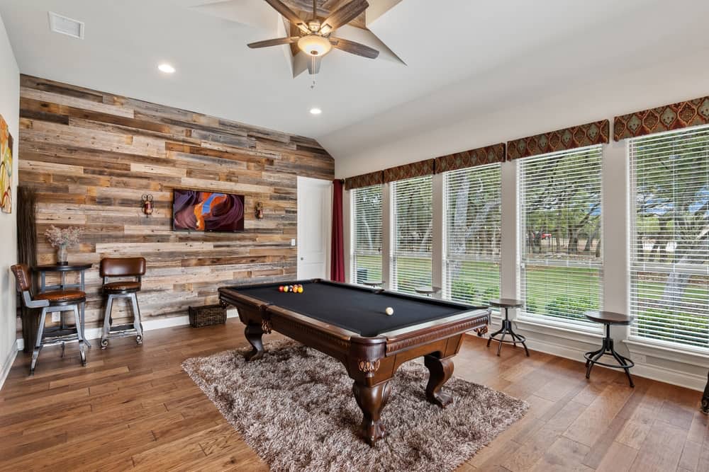A pool table in a living room