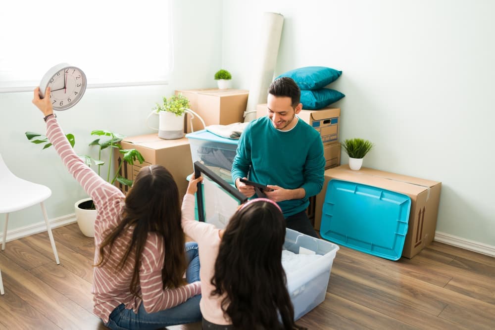 A family packing things away in boxes