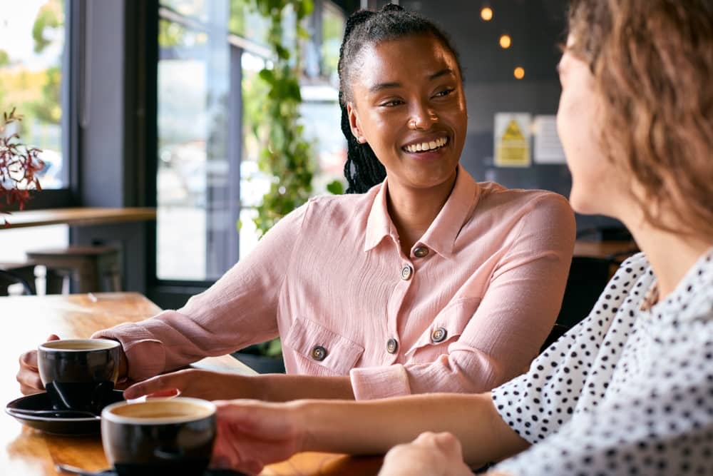 Two women talking in a coffee shop