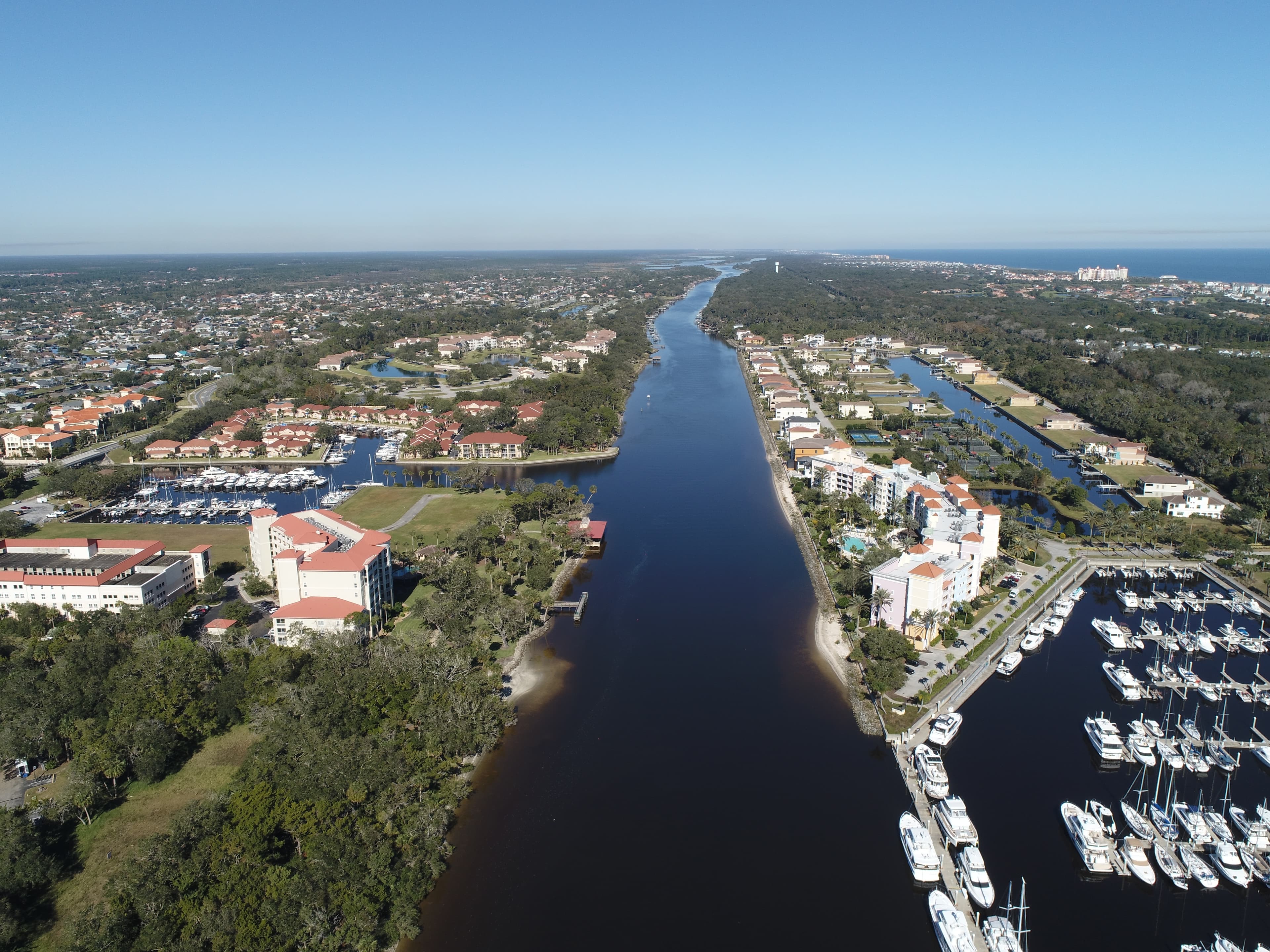 Aerial view of Palm Coast, FL with waterways, homes, and green spaces