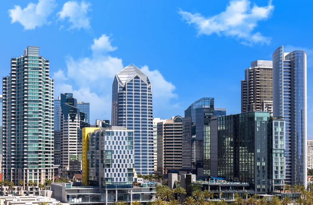 Skyline of modern high-rise buildings in downtown San Diego on a clear, sunny day.