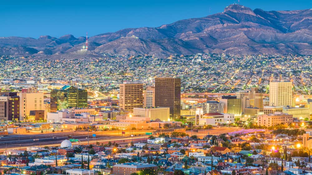 El Paso, TX city skyline with mountains in background at dusk