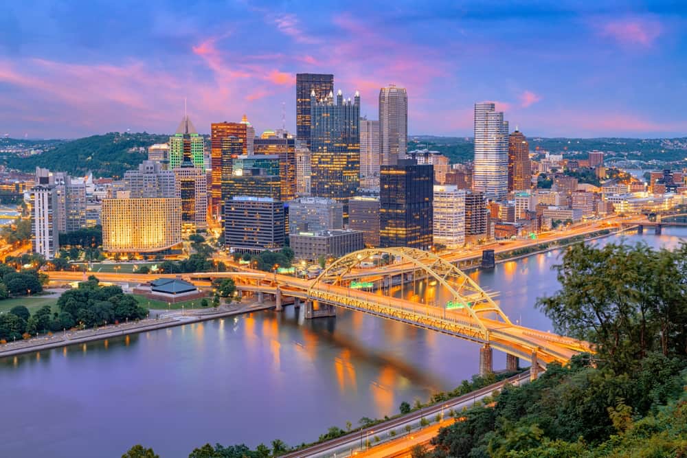 Aerial view of downtown Pittsburgh and a bridge over the water.