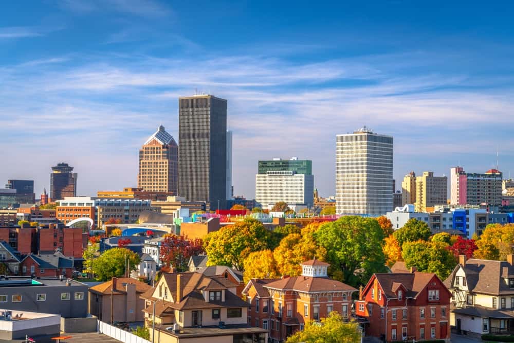 View of Rochester, NY's cityscape on an autumn day with blue skies.