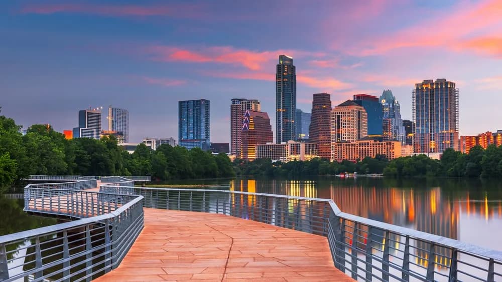 Austin skyline overlooking a bridge at sunset