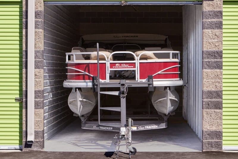 Boat inside a drive-up storage unit