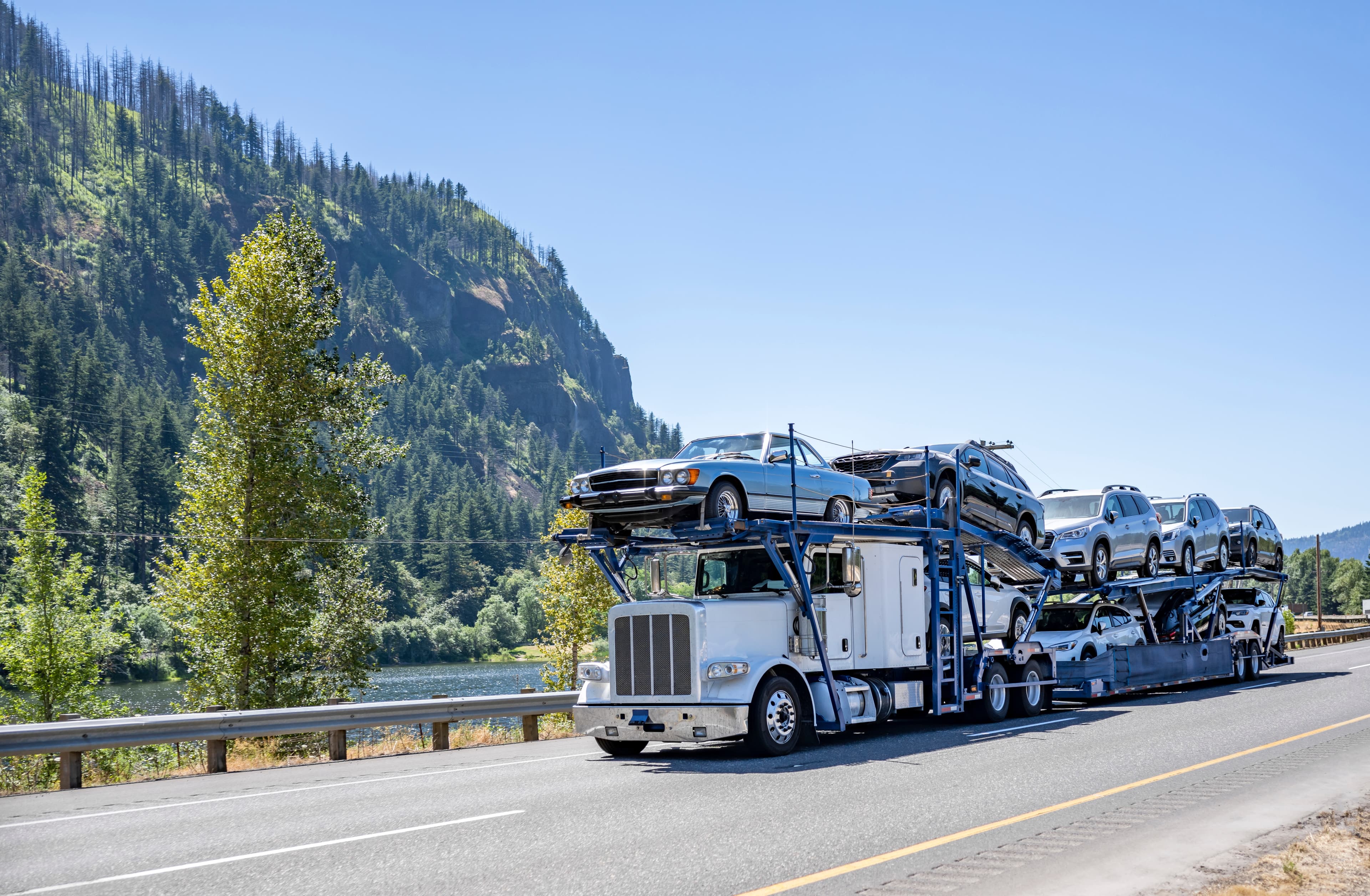 Semi truck transporting cars on it