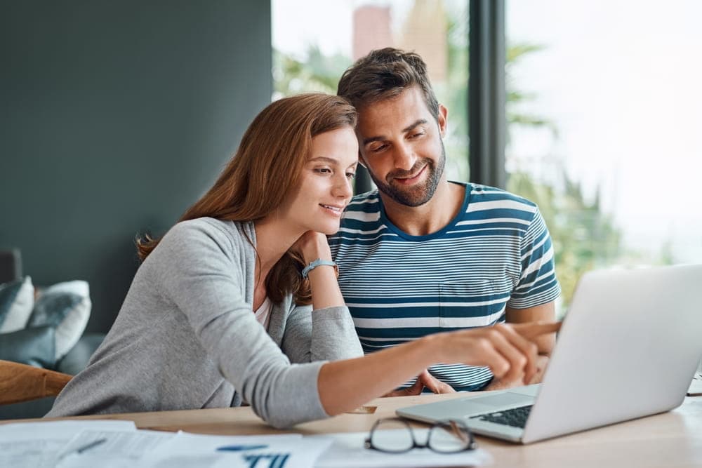 A couple looking at a laptop