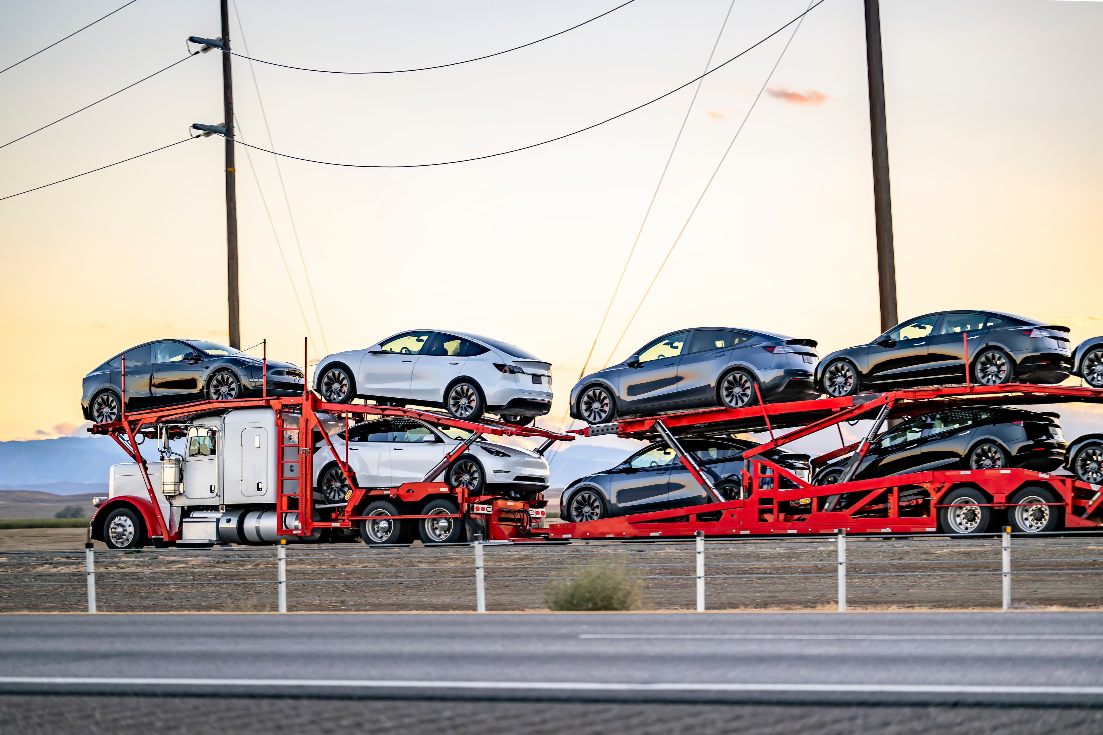 Truck on the road transporting cars