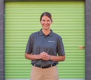 employee in front of storage unit