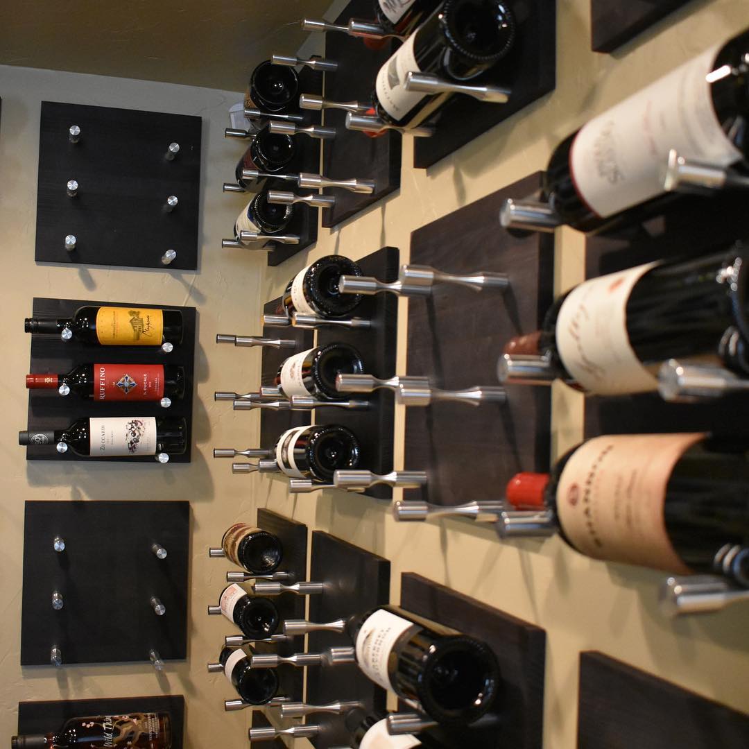 Wine racks mounted on wall. Photo by Instagram user @vintageview_usa
