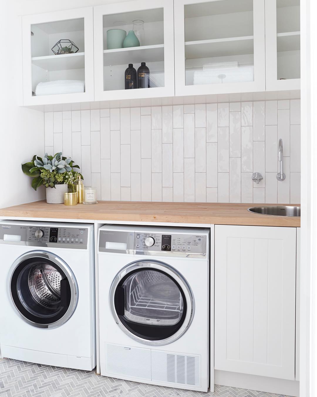Washer-dryer combo in laundry room. Photo by Instagram user @threebirdsrenovations