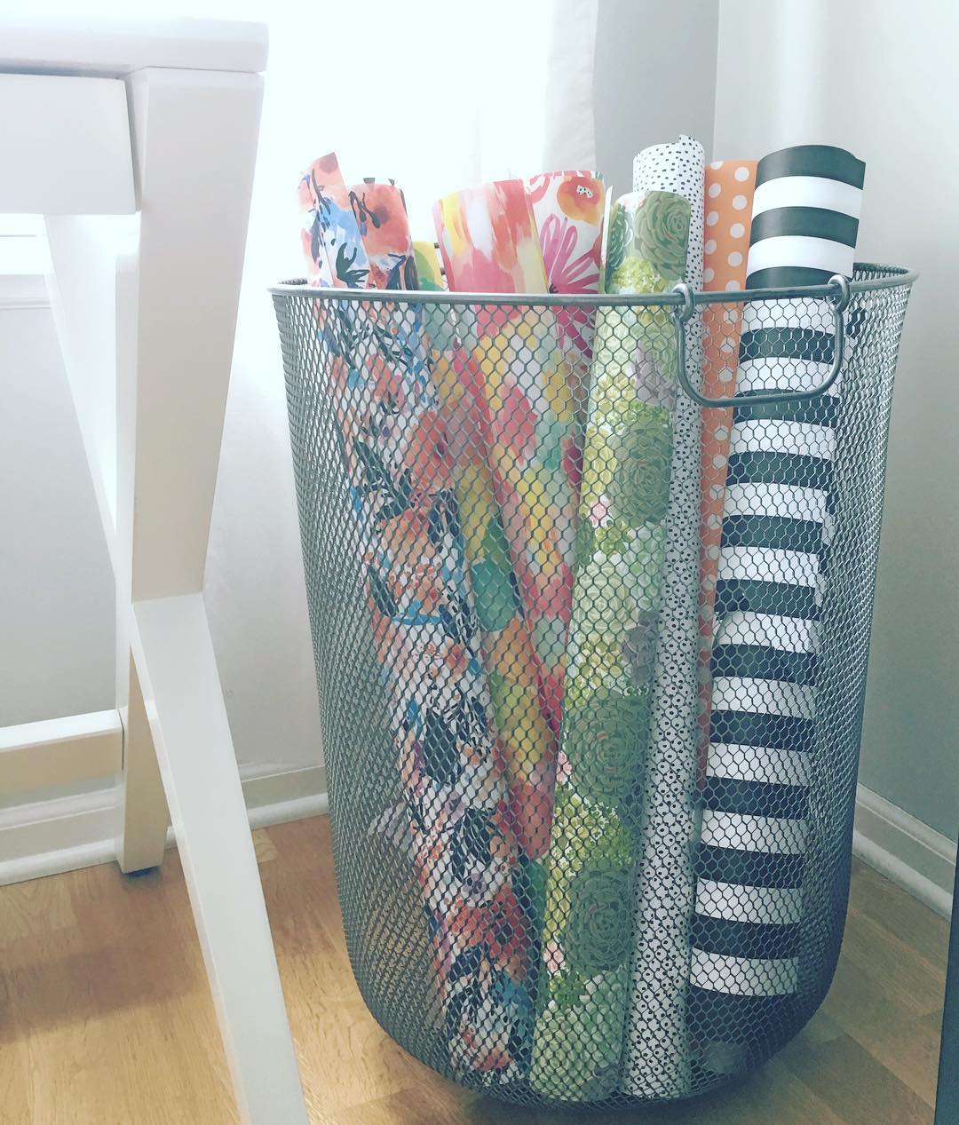 Wrapping paper in wire bin. Photo by Instagram user @mylittledesigncompany