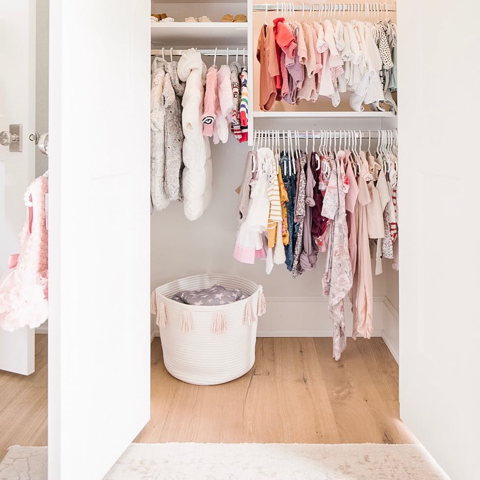 Closet full of baby clothes on multiple levels. Photo by Instagram user @twigandtassel