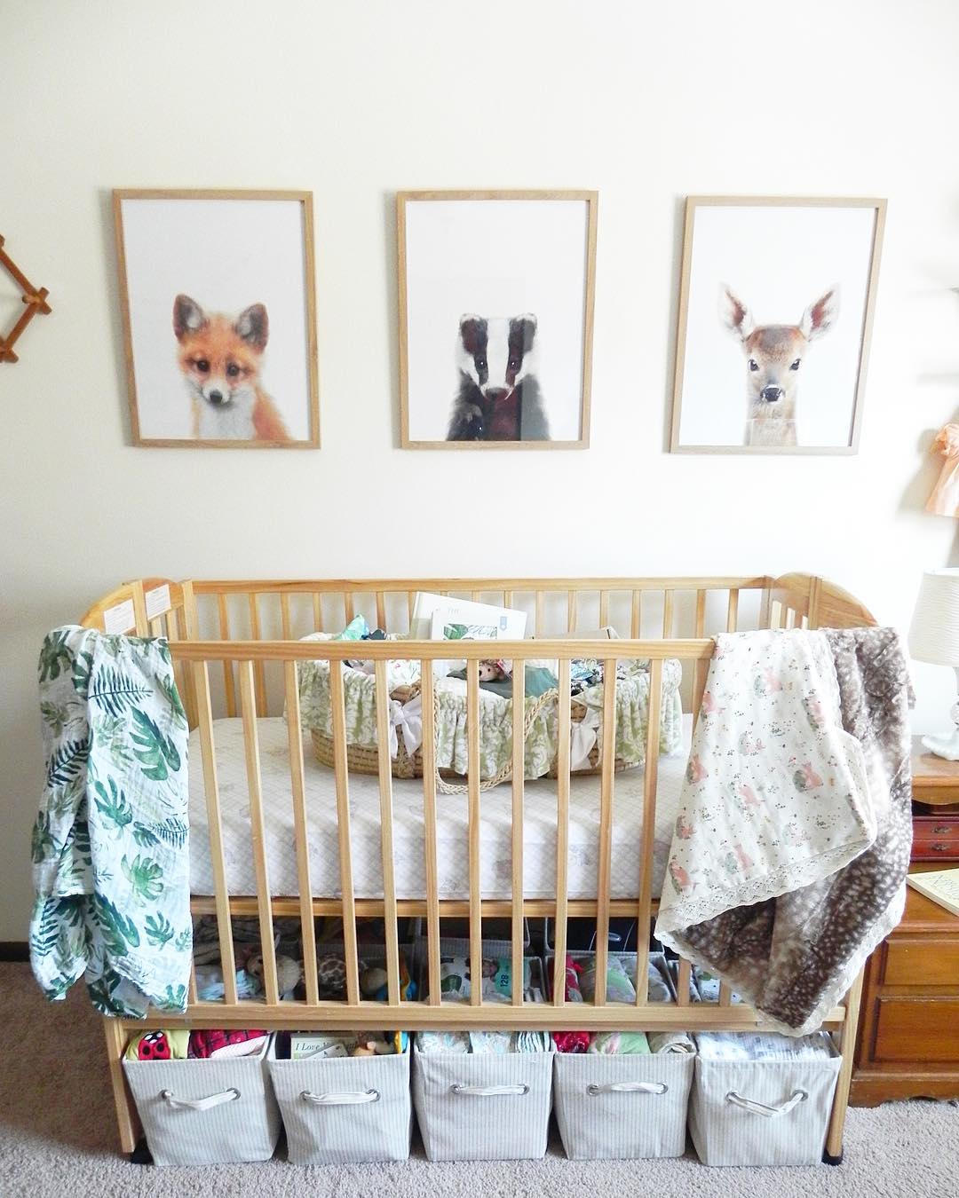Storage bins under baby crib in small home. Photo by Instagram user @4_little_1