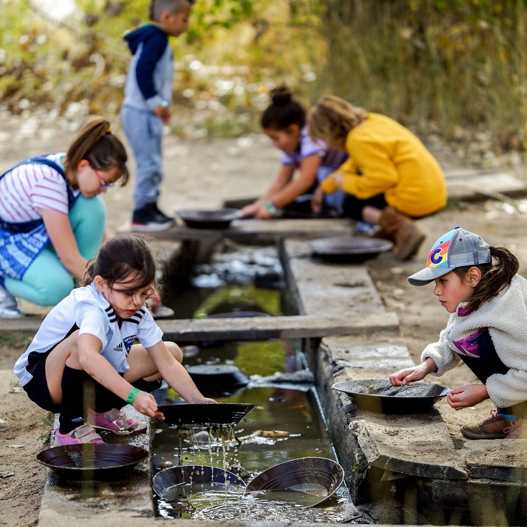 Kids Using Sluice Pans to Find Gems and Fools Gold in Denver. Photo by Instagram user @fourmilehistoricpark