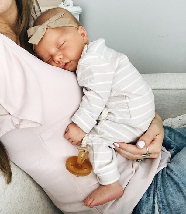 Newborn baby resting on mother. Photo by Instagram user @maternalamerica