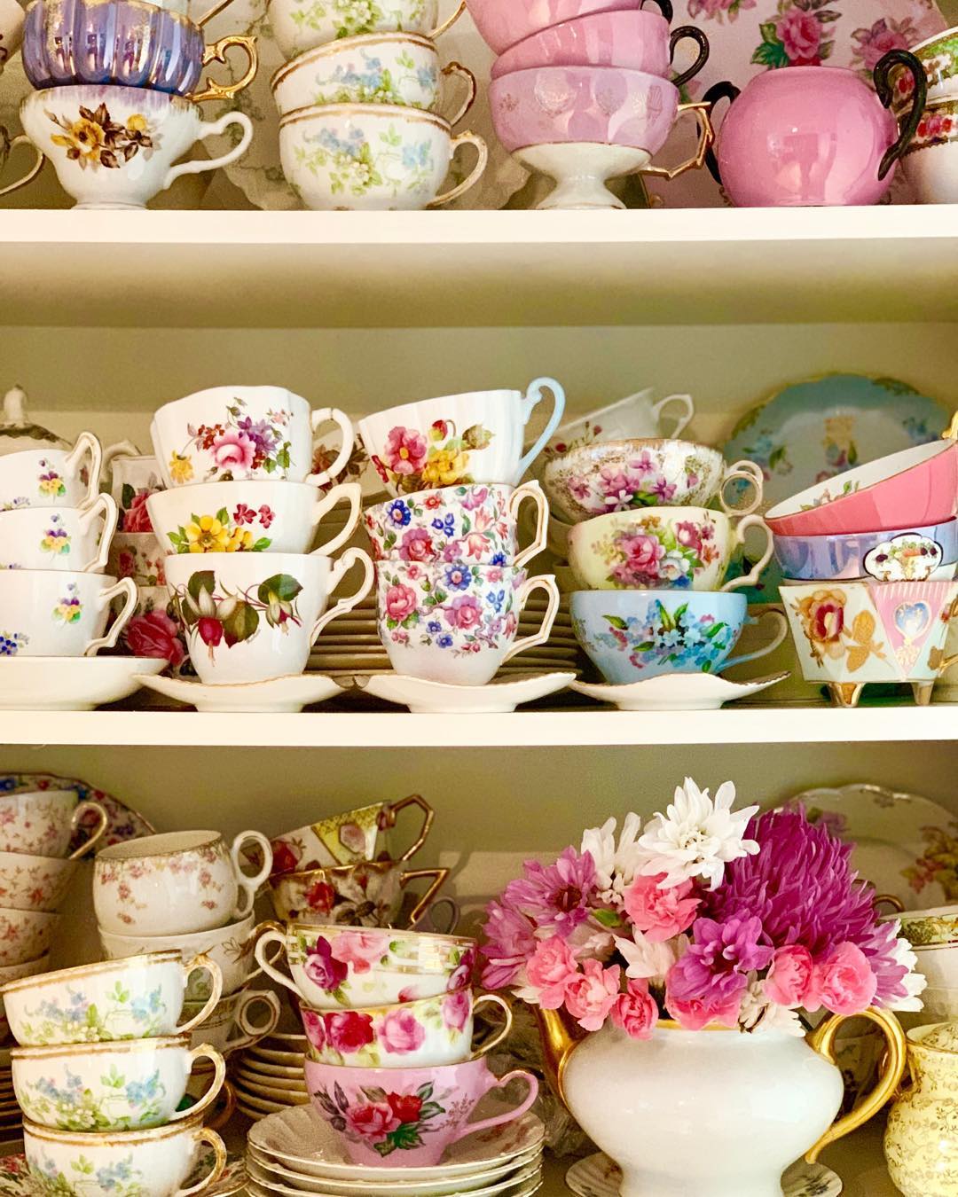 Shelves with teacups. Photo by Instagram user @calbert1000