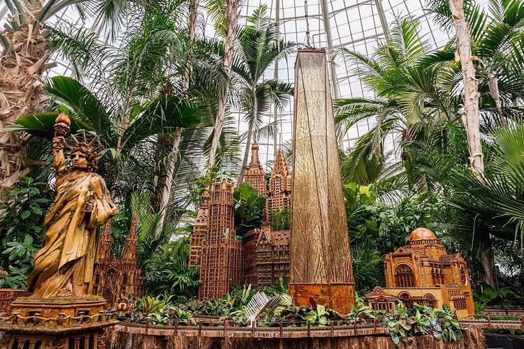 Greenery and statutes under a paned dome. Photo by Instagram user @reevesreedarboretum