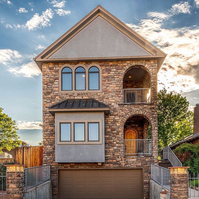 Brick home with cloudy sky behind it in Capitol Hill, Denver