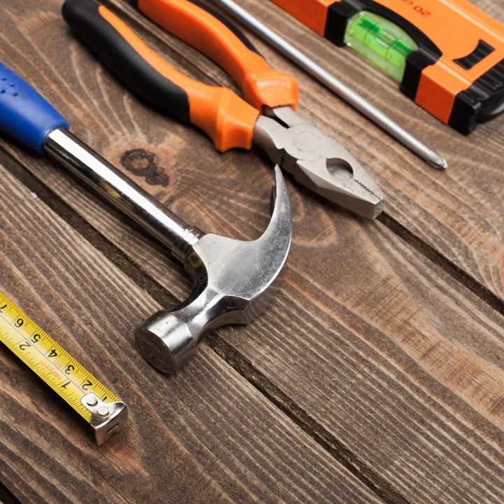 Household tools on wooden table. Photo by Instagram user @thekdpgroup