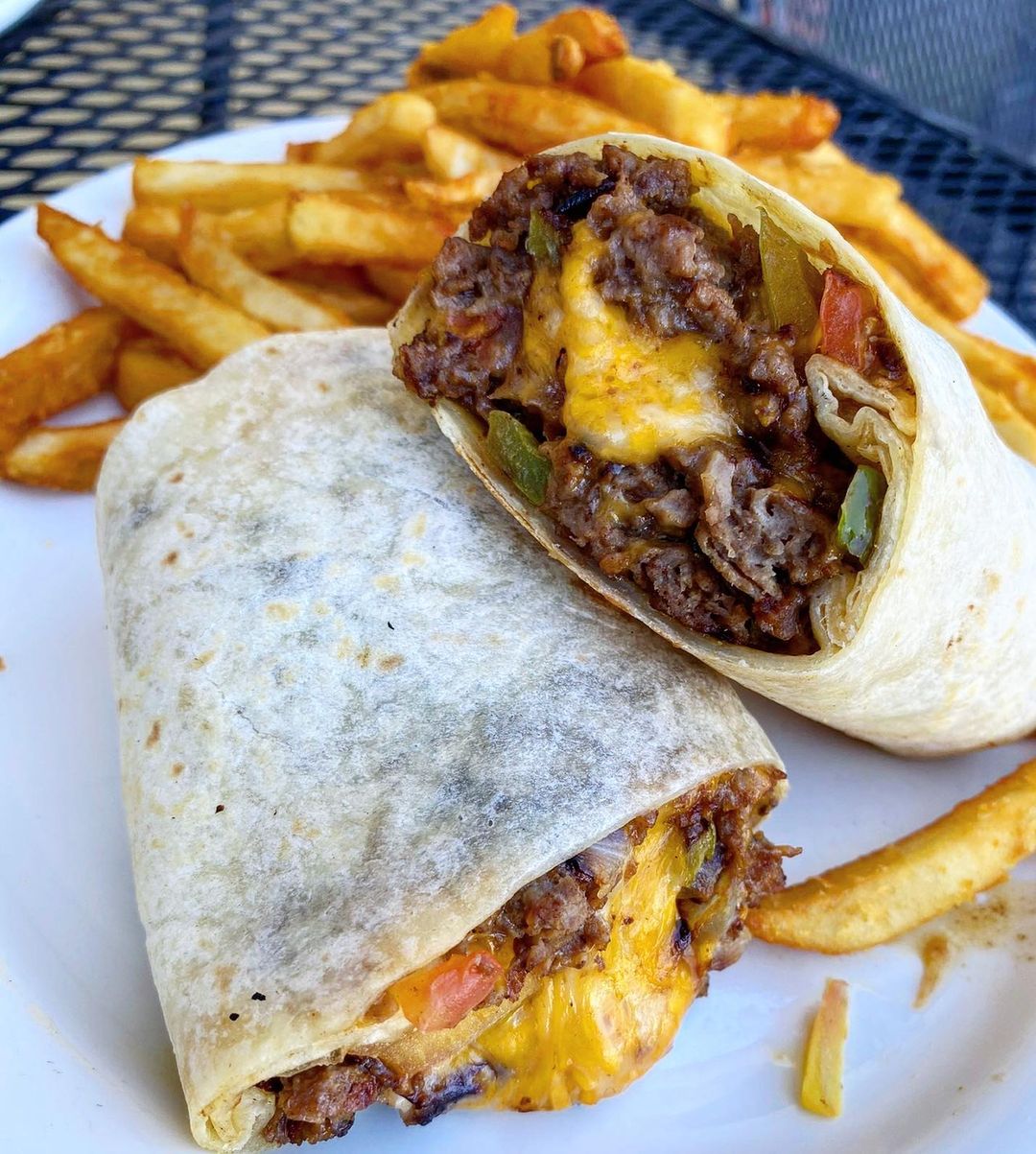 Breakfast burrito and fries. Photo by @griddlecakeslv