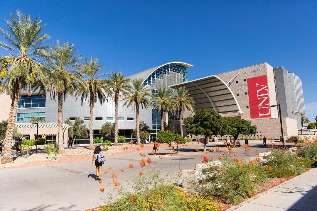 University Nevada Las Vegas campus and student walking. Photo by @unlvadmissions