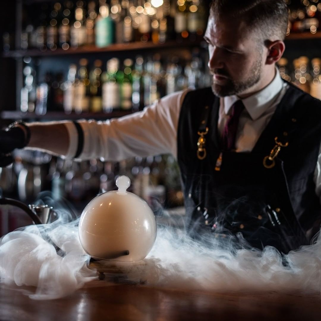 Bartender Making a Smoky Drink at the Green Russell. Photo by Instagram user @greenrussell_denver