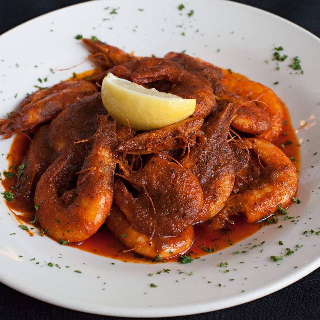 Plate of New Orleans Style BBQ Shrimp from NoNo's Cafe. Photo by Instagram user @nonos_cafe