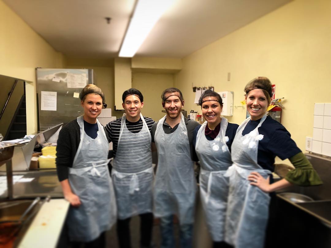 Volunteers with Aprons Working in a Soup Kitchen. Photo by Instagram user @betterworks