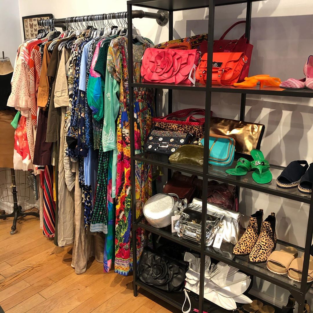 Hanging Rack with Dresses and Shelves with Purses and Women's Shoes. Photo by Instagram user @housingworks