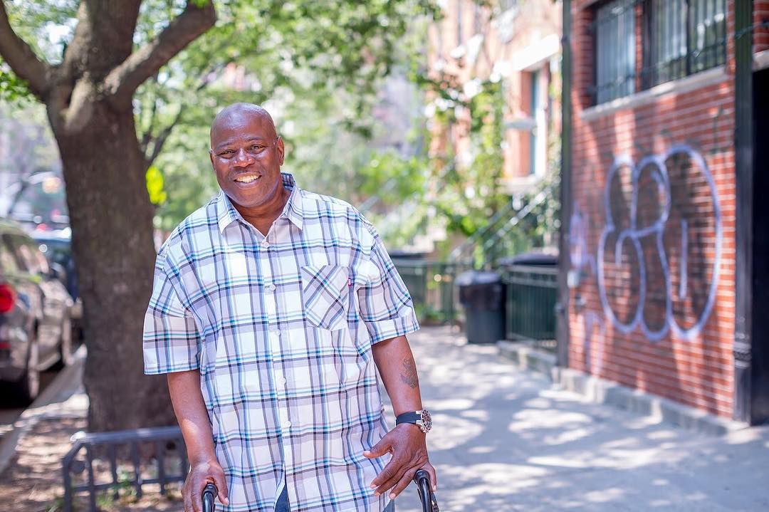 Man Smiling on the Streets of New York. Photo by Instagram user @nazarethhousing
