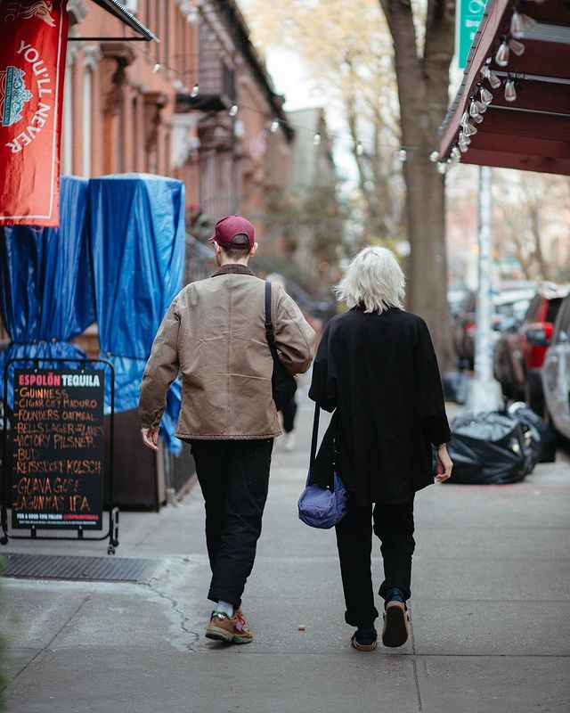 Two people walking through the streets of New York City. Photo by Instagram user @shannonknighttt