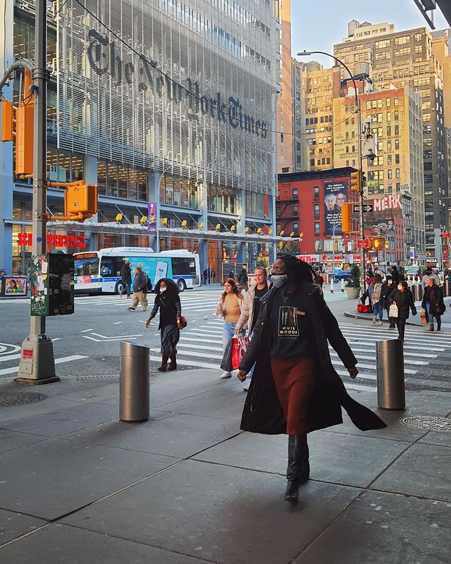 Pedestrians walking passed the New York Times Building. Instagram Photo by user @toninopanino