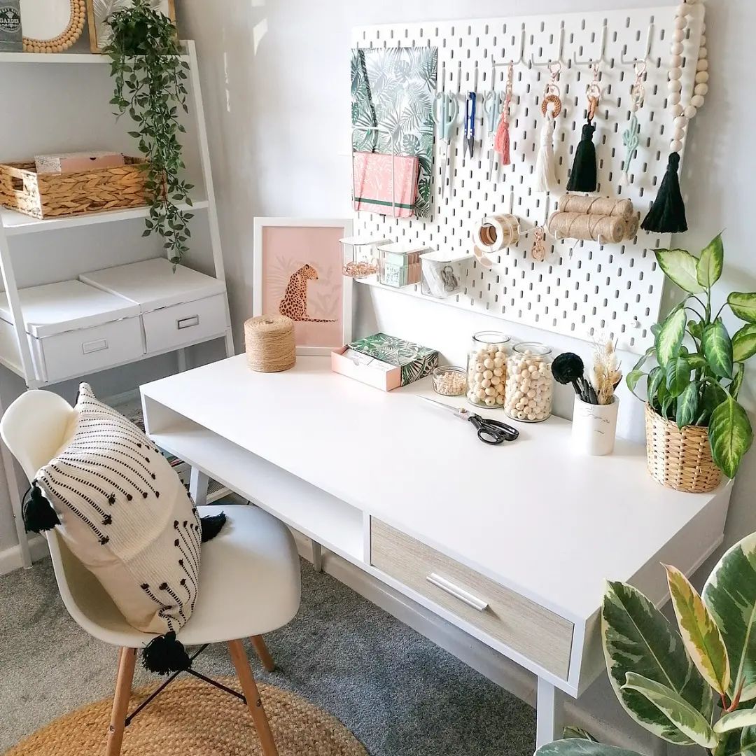 A shelf for crafts above a white desk. Photo by Instagram user @celticcorddesignsuk