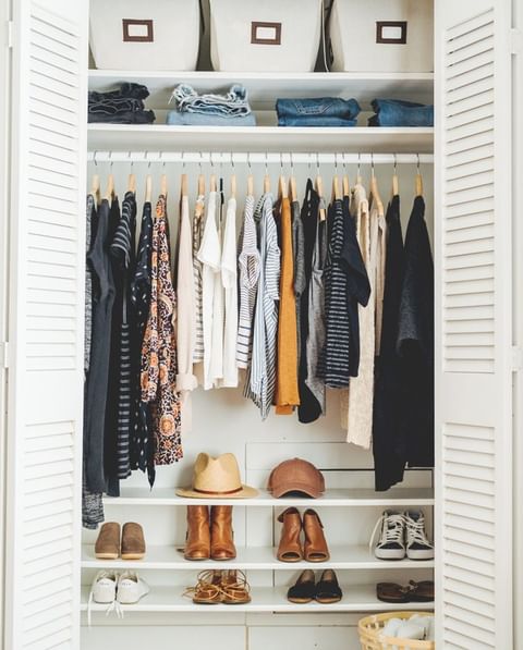 Tidying up clothes and shoes in closet. Photo by Instagram user @konmari.co
