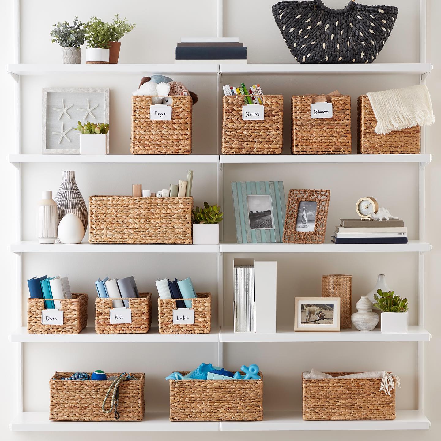 Organizing bins on shelves. Photo by Instagram user @thecontainerstore