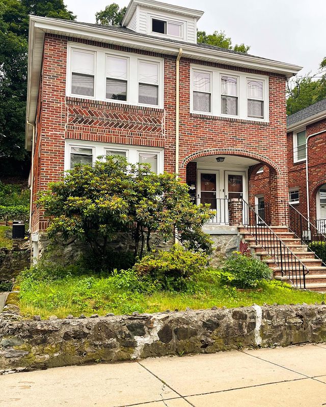 Brick two-story home in Allston-Brighton, Boston. Photo by Instagram user @realtywithtang