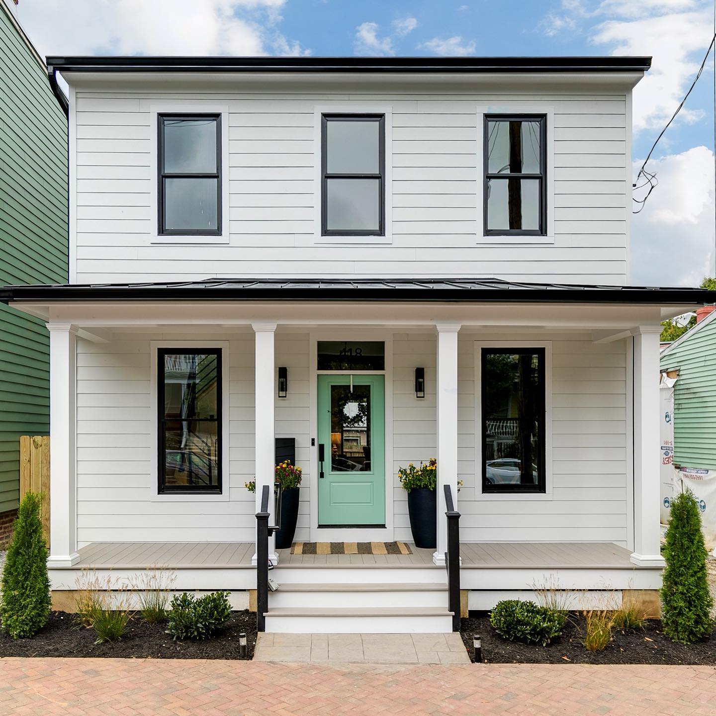 Two-story American Foursquare home in the Church Hill neighborhood of Richmond, VA. Photo by Instagram user @christianbrockrva