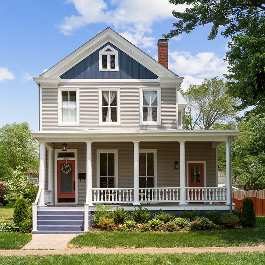 Two-story American Foursquare home with a large deck in the Woodland Heights neighborhood of Richmond, VA. Photo by Instagram user @srmf_real_estate