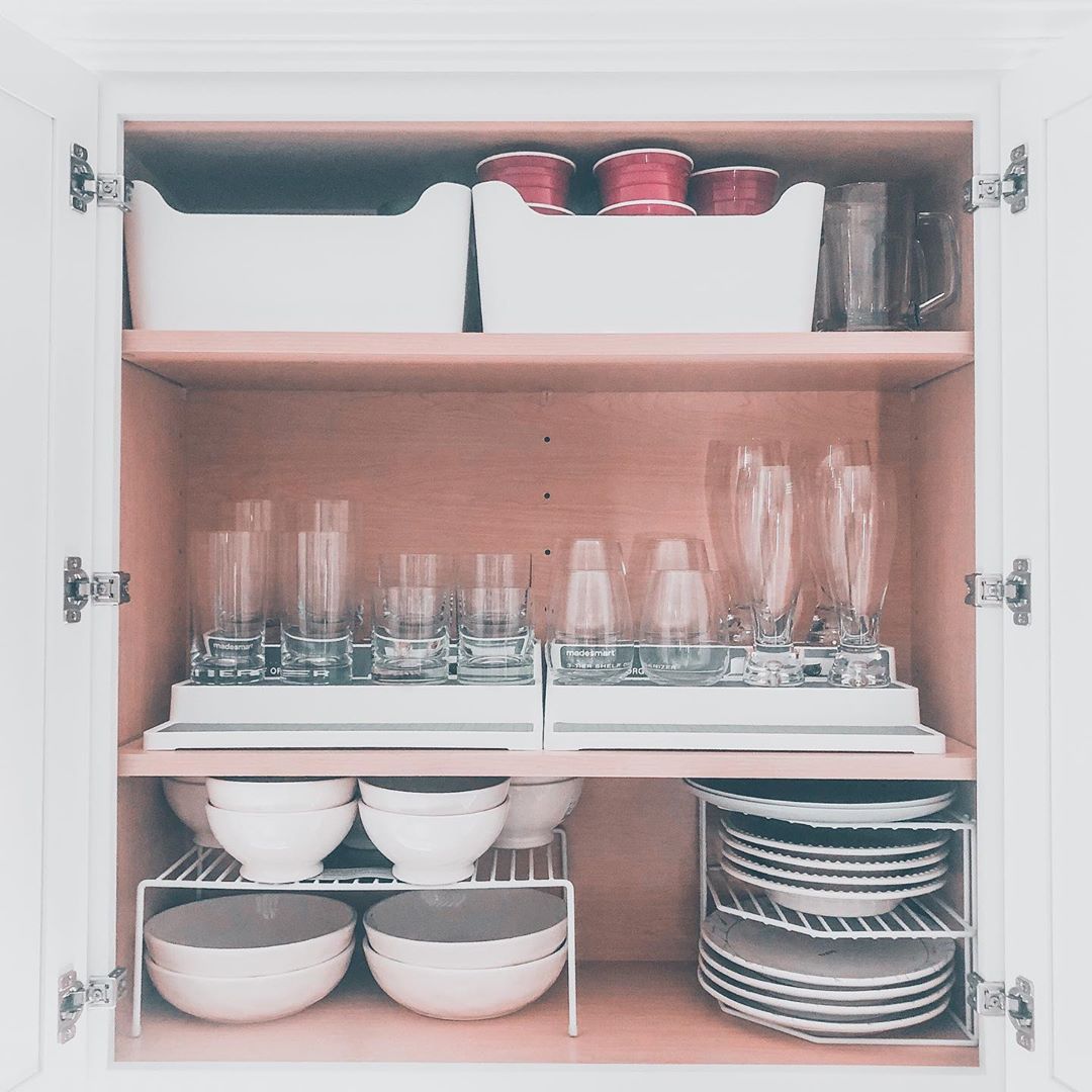 Kitchen cabinet with dish organizers. Photo by Instagram user @house_on_lew