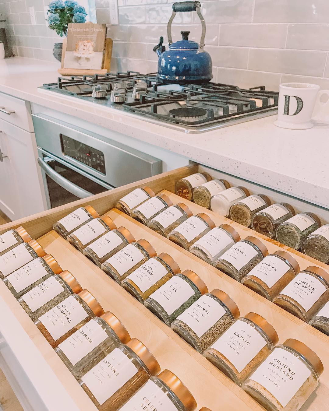 Spice drawer with custom-labeled spices. Photo by Instagram user @thepetalcompany