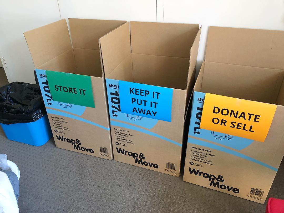 Three boxes labeled store, keep, and donate. Photo by Instagram user @debbdesign