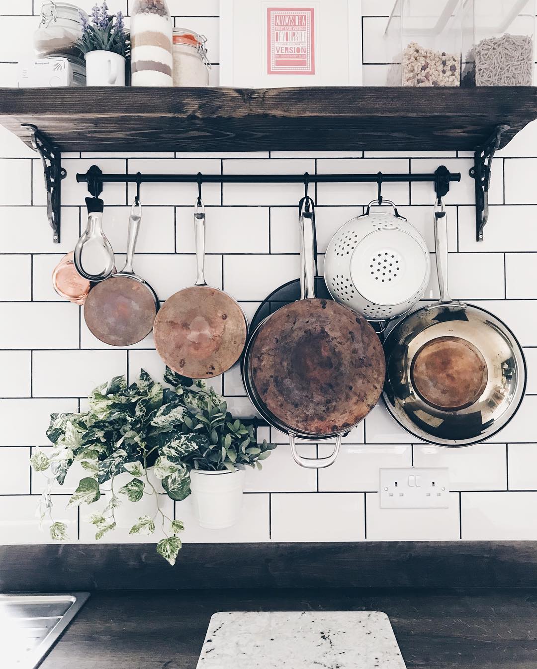 Hanging rack with pots and pans. Photo by Instagram user @world_of_heather
